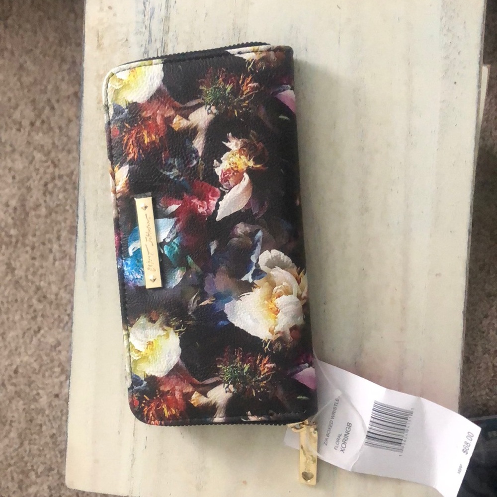 NWT Betsy Johnson floral XoringB wristlet. It is missing the wristlet strap